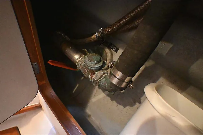 Slide: The Image of Plumbing system inside 1989 Ta Shing Yachts Taswell 43, featuring pipes and valves. - 72
