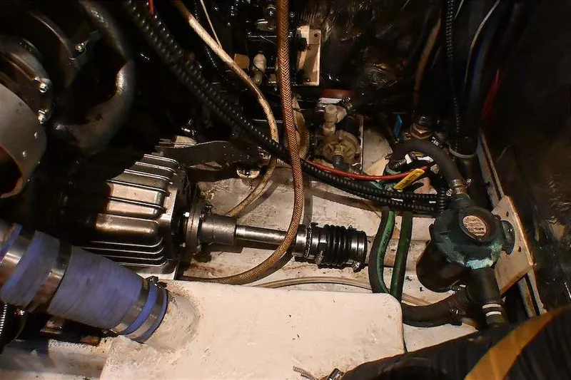 Slide: The Image of Engine compartment of 1989 Ta Shing Yachts Taswell 43, showcasing mechanical components and wiring. - 82