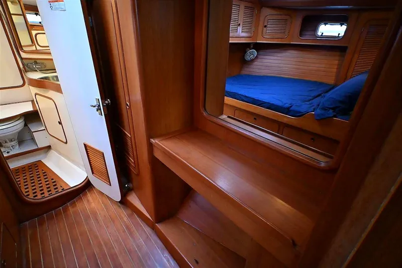 Slide: The Image of 1989 Ta Shing Yachts Taswell 43 interior with wooden cabin, bed, and bathroom. - 68