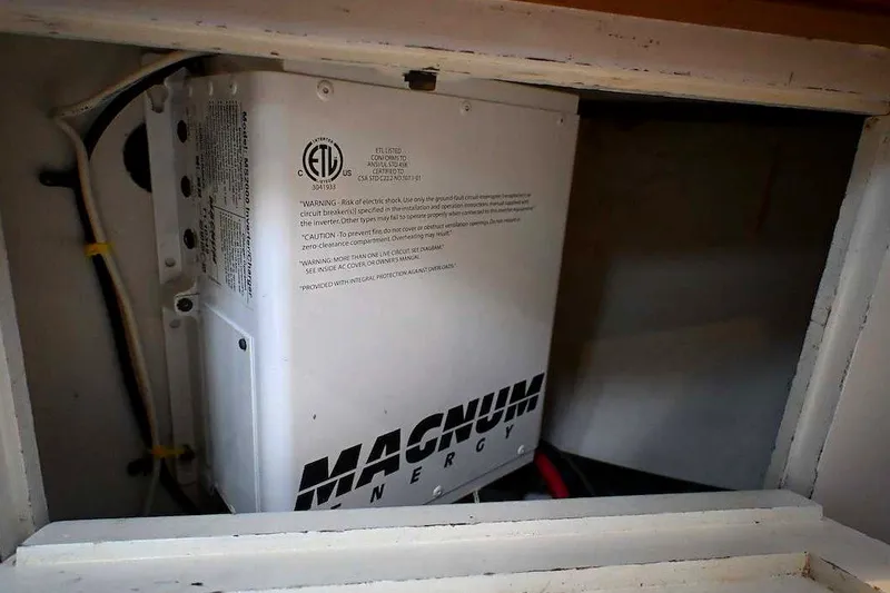 Slide: The Image of Magnum Energy inverter inside 1989 Ta Shing Yachts Taswell 43 compartment. - 84