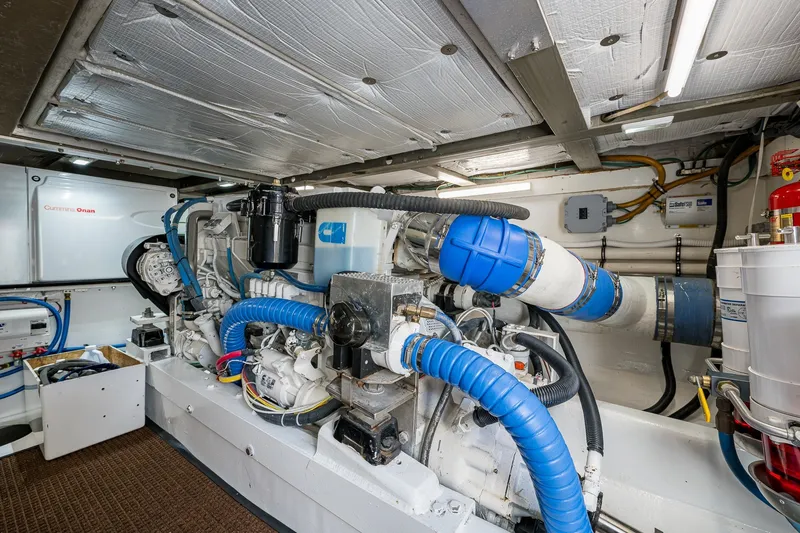 Slide: The Image of Engine room of 1986 Buddy Davis 47 Convertible yacht, featuring Cummins Onan generator. - 17