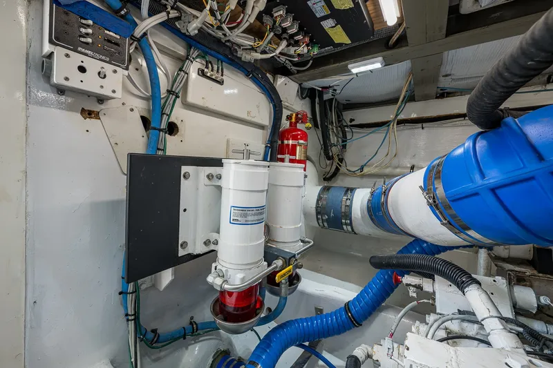 Slide: The Image of Engine room of 1986 Buddy Davis 47 Convertible with wiring and filtration systems. - 22