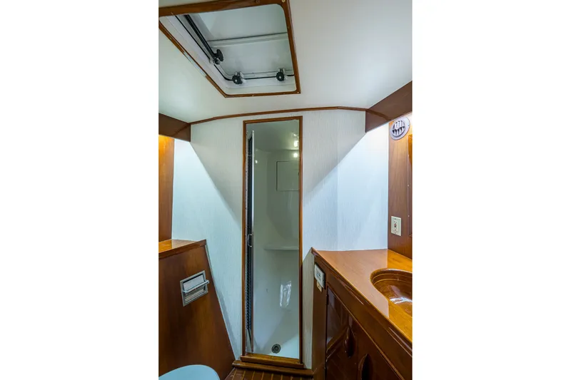 Slide: The Image of Interior of 1986 Buddy Davis 47 Convertible yacht bathroom with wood accents and shower. - 34