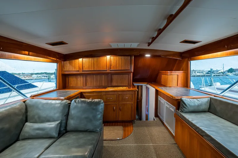 Slide: The Image of Interior of 1986 Buddy Davis 47 Convertible yacht with wood cabinetry and seating. - 69