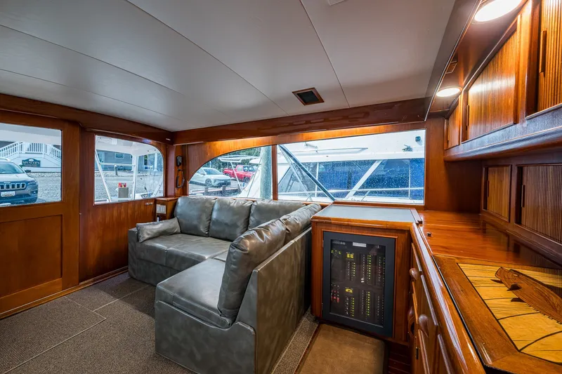 Slide: The Image of Interior of 1986 Buddy Davis 47 Convertible yacht with leather sofa and wooden cabinetry. - 71