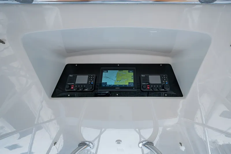 Slide: The Image of Control panel of a 1986 Buddy Davis 47 Convertible boat with navigation equipment. - 28