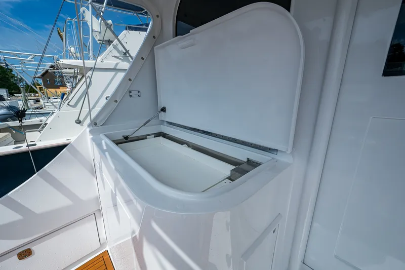 Slide: The Image of Open storage compartment on 1986 Buddy Davis 47 Convertible yacht deck. - 11