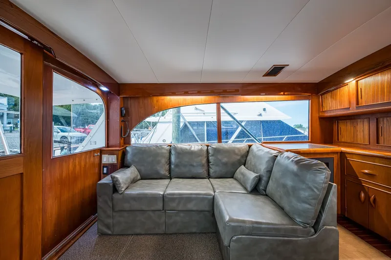 Slide: The Image of Interior of 1986 Buddy Davis 47 Convertible yacht with leather sofa and wooden cabinetry. - 70