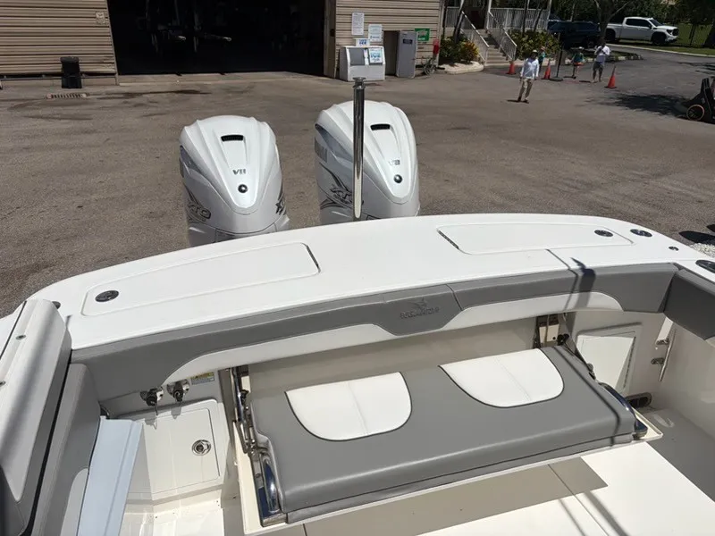 Slide: The Image of The image shows the stern of a 2022 Regulator 31 boat with two outboard engines. - 5