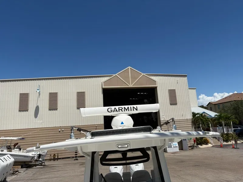 Slide: The Image of 2022 Regulator 31 with Garmin equipment in front of a large warehouse. - 18