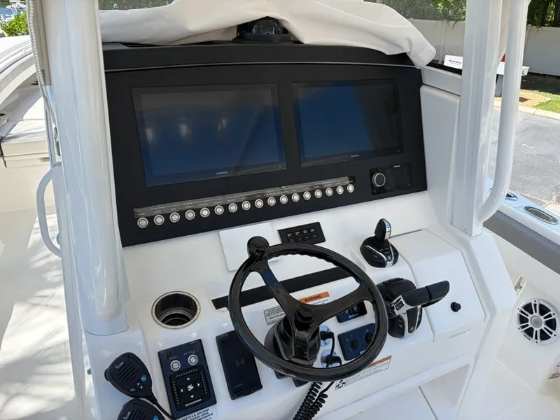 Slide: The Image of The image shows the helm of a 2022 Regulator 31 boat with modern instruments. - 9
