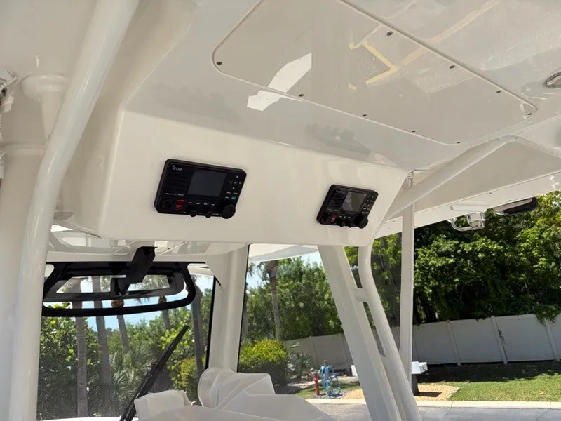 Slide: The Image of The image shows the cockpit of a 2022 Regulator 31 boat with electronic controls. - 16