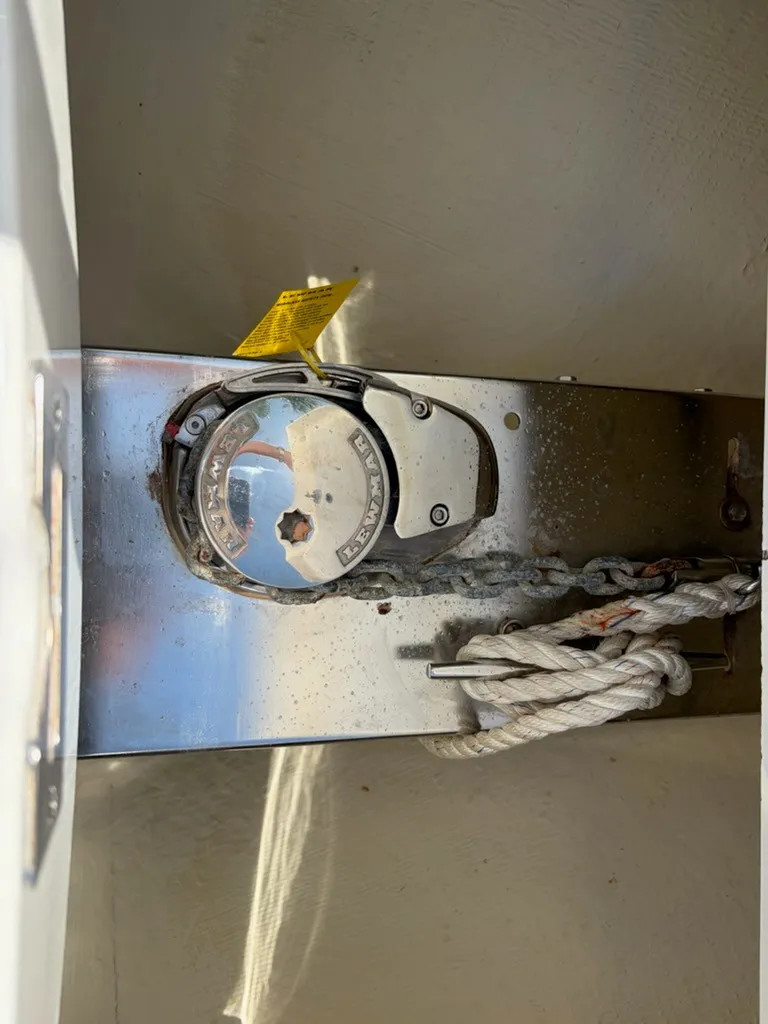 Slide: The Image of Close-up of a boat winch mechanism with rope. - 19