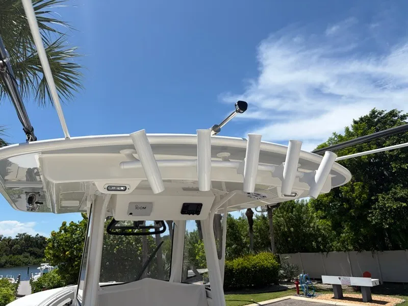 Slide: The Image of The image shows the roof of a Regulator 31 boat with fishing rod holders. - 8