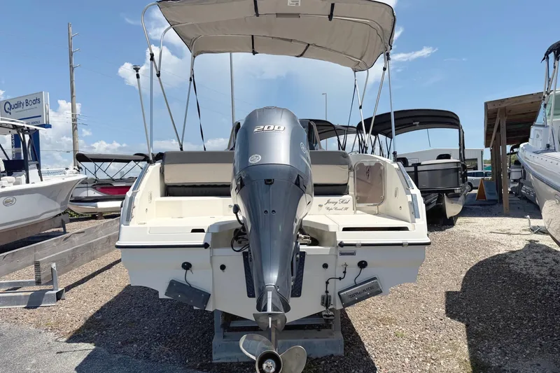 Slide: The Image of 2021 Parker Poland 690 Sport boat with 200 HP engine, parked outdoors. - 3