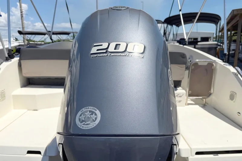 Slide: The Image of Outboard motor on 2021 Parker Poland 690 Sport boat, featuring 200 horsepower engine. - 4