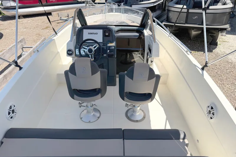 Slide: The Image of Interior view of 2021 Parker Poland 690 Sport boat with dual seats and steering console. - 8