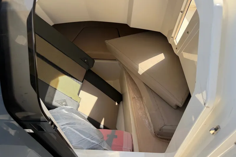 Slide: The Image of Interior cabin view of 2021 Parker Poland 690 Sport boat with seating and cushions. - 13