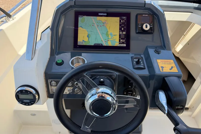Slide: The Image of Cockpit of 2021 Parker Poland 690 Sport boat with navigation system and controls. - 10