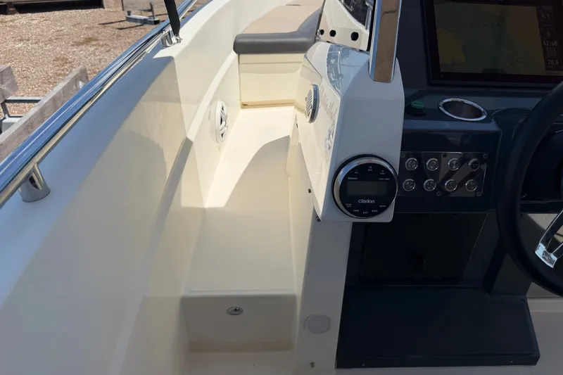 Slide: The Image of Interior view of 2021 Parker Poland 690 Sport boat cockpit with control panel. - 15