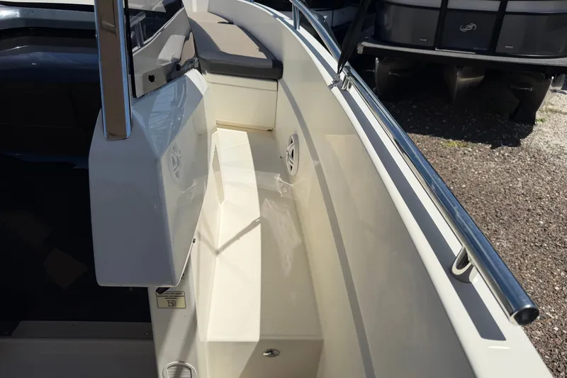 Slide: The Image of 2021 Parker Poland 690 Sport boat interior with seating and railing details. - 14