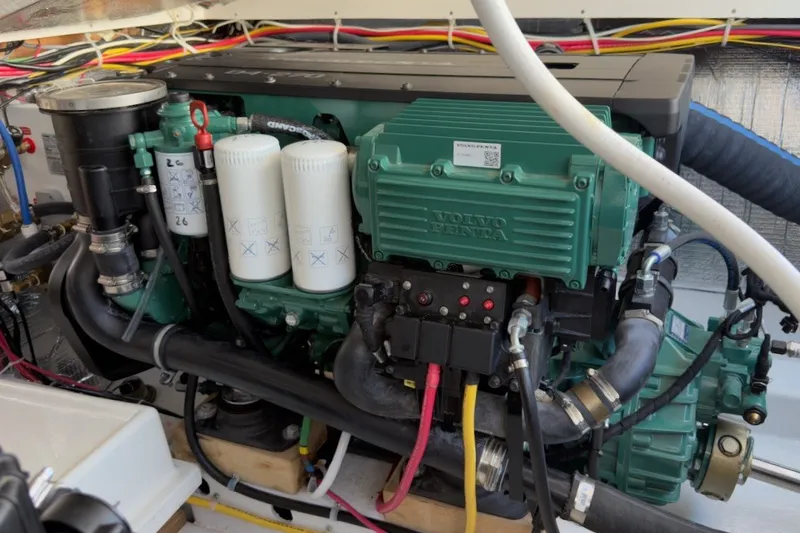 Slide: The Image of Engine compartment of a 2023 Fortier 33 boat featuring a Volvo Penta engine. - 67