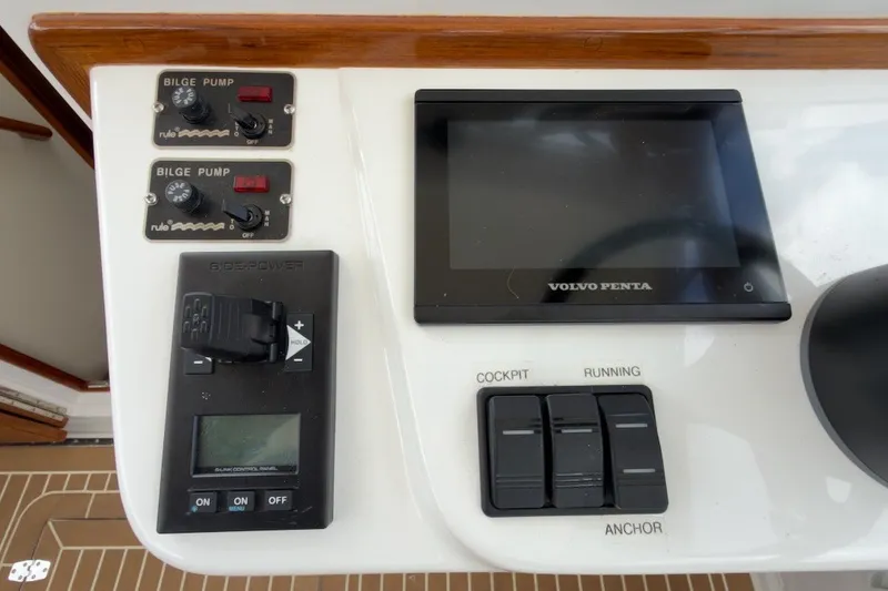 Slide: The Image of Control panel of 2023 Fortier 33 boat with bilge pump and Volvo Penta display. - 34
