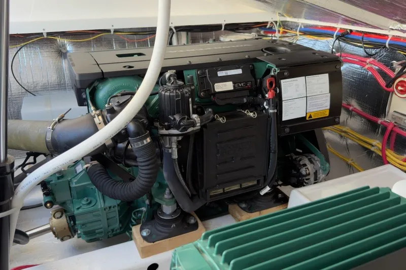 Slide: The Image of Engine compartment of a 2023 Fortier 33 boat, showcasing detailed wiring and components. - 66