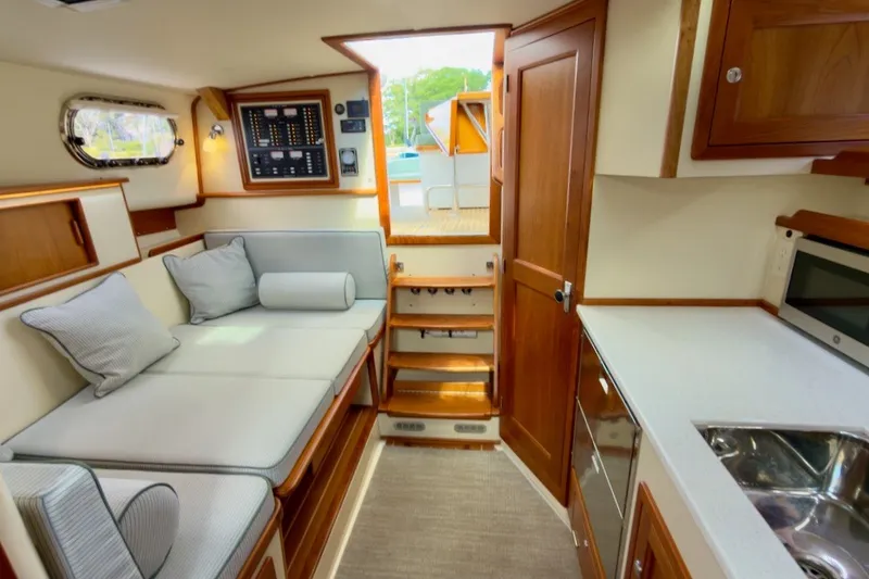 Slide: The Image of Interior of 2023 Fortier 33 boat with cozy seating and modern amenities. - 41