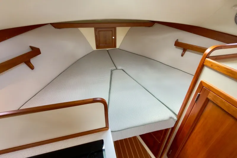 Slide: The Image of 2023 Fortier 33 boat interior with cozy cabin and wooden accents. - 44
