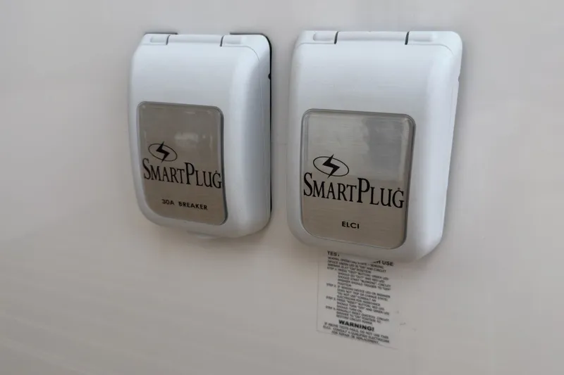 Slide: The Image of SmartPlug outlets on 2023 Fortier 33 boat, featuring 30A breaker and ELCI protection. - 77