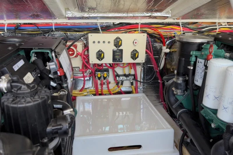 Slide: The Image of Engine room of 2023 Fortier 33 boat with wiring and control panel. - 70