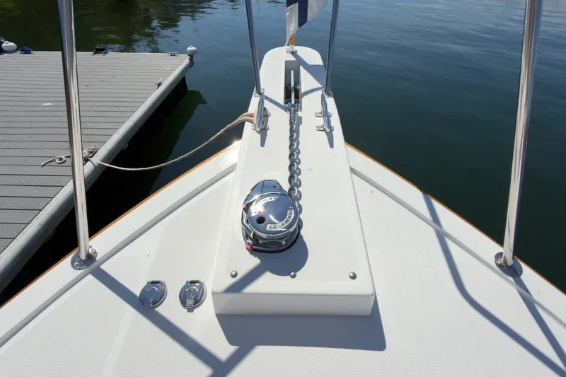Slide: The Image of Bow of 2023 Fortier 33 boat with anchor chain and dock view. - 75