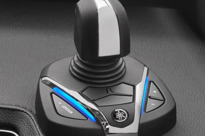 Slide: The Image of Joystick control of 2027 Yamaha Boats 295XD, featuring sleek design and illuminated buttons. - 9
