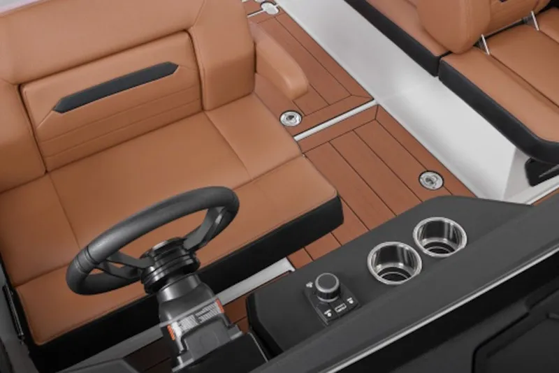 Slide: The Image of Luxurious interior of 2027 Yamaha Boats 295XD with tan seating and modern controls. - 10