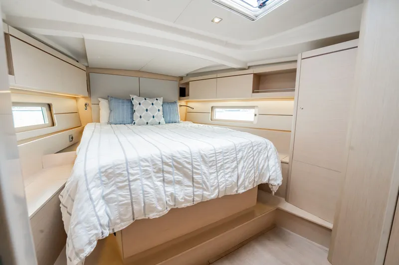 Slide: The Image of Luxurious cabin interior of 2020 Beneteau Oceanis 46.1 yacht with cozy bedding. - 28