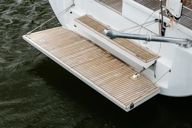Slide: The Image of Teak swim platform on 2020 Beneteau Oceanis 46.1 yacht, floating on water. - 13