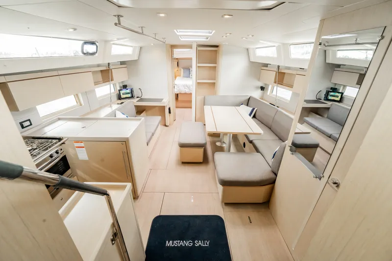 Slide: The Image of Spacious interior of 2020 Beneteau Oceanis 46.1 yacht with modern furnishings and ample natural light. - 15