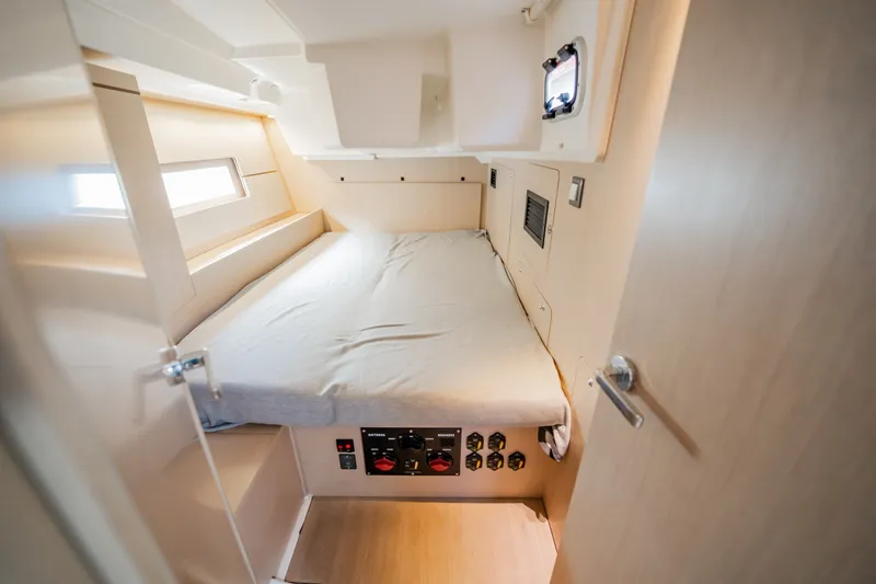 Slide: The Image of Interior cabin of 2020 Beneteau Oceanis 46.1 yacht, featuring a cozy bed and modern design. - 33