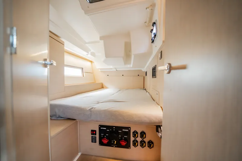 Slide: The Image of Interior cabin of 2020 Beneteau Oceanis 46.1 yacht, featuring a cozy bed and modern design. - 34