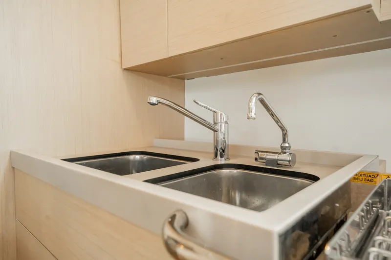 Slide: The Image of Modern kitchen sink with dual faucets in 2020 Beneteau Oceanis 46.1 yacht. - 24