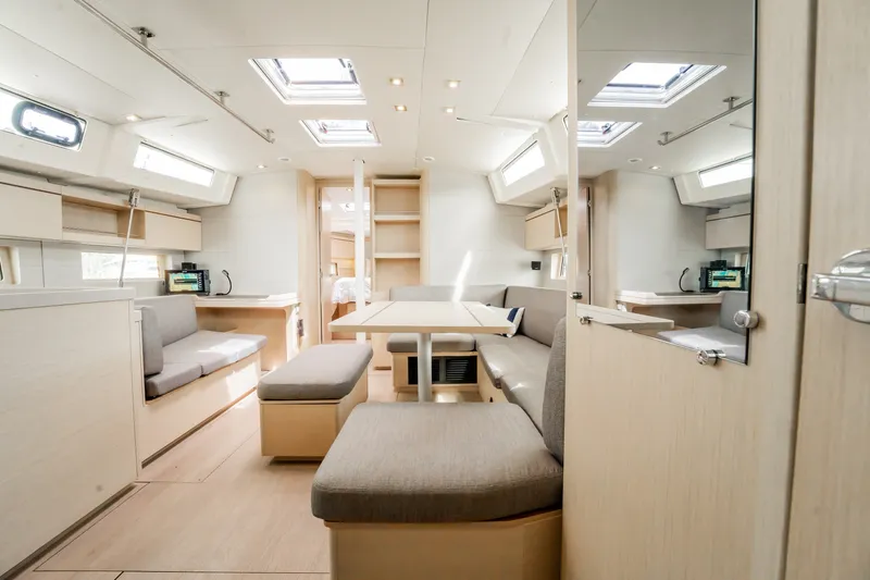 Slide: The Image of Spacious interior of 2020 Beneteau Oceanis 46.1 yacht with modern furnishings and ample natural light. - 19