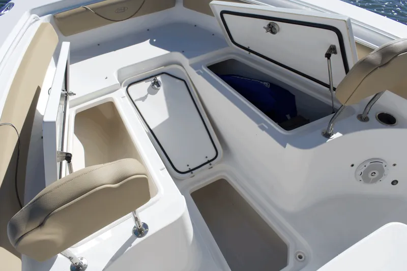 Slide: The Image of 2017 Sea Hunt Gamefish 27FS boat interior with open storage compartments. - 10