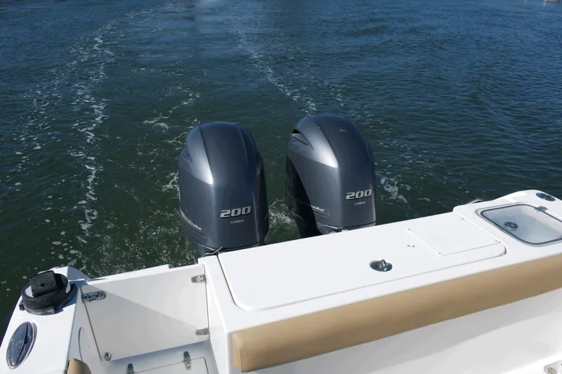 Slide: The Image of 2017 Sea Hunt Gamefish 27FS with twin Yamaha 200 engines on water. - 20