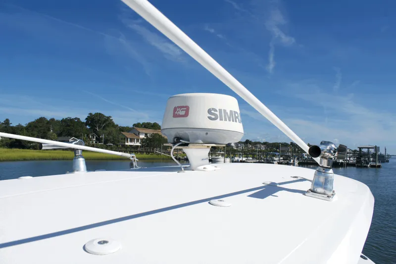 Slide: The Image of 2017 Sea Hunt Gamefish 27FS boat with Simrad radar on calm water. - 23