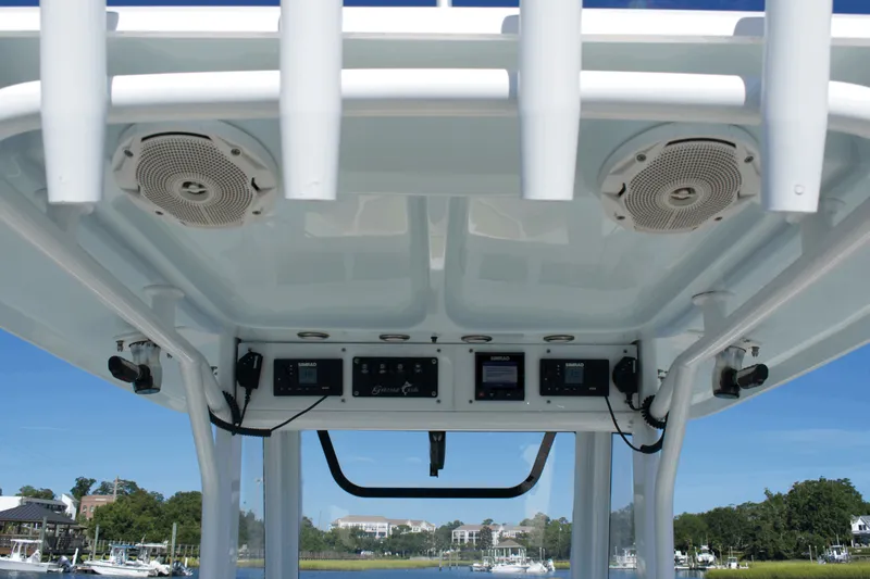 Slide: The Image of 2017 Sea Hunt Gamefish 27FS boat console with speakers and electronic controls. - 18