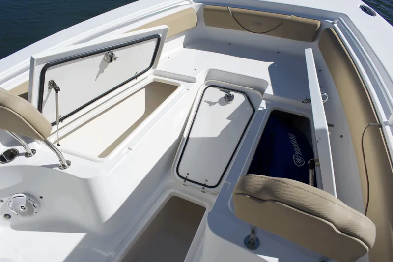 Slide: The Image of 2017 Sea Hunt Gamefish 27FS boat interior with open storage compartments. - 11