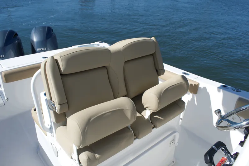 Slide: The Image of 2017 Sea Hunt Gamefish 27FS boat with dual beige captain seats and twin engines. - 17