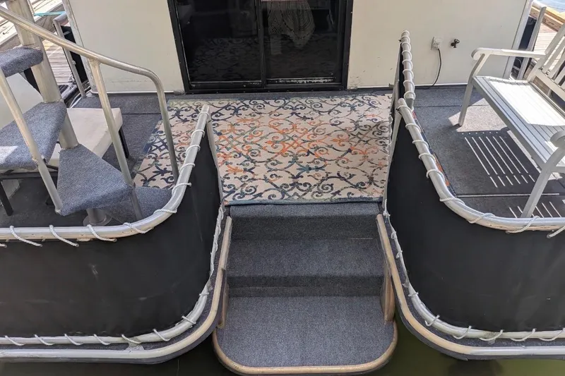 Slide: The Image of Steps and seating area on a 1996 Stardust Cruisers 14.5 x 69 houseboat. - 44