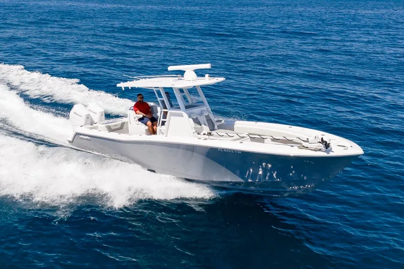 Slide: The Image of 2025 Invincible 33 Open Fisherman cruising on open ocean waters. - 64